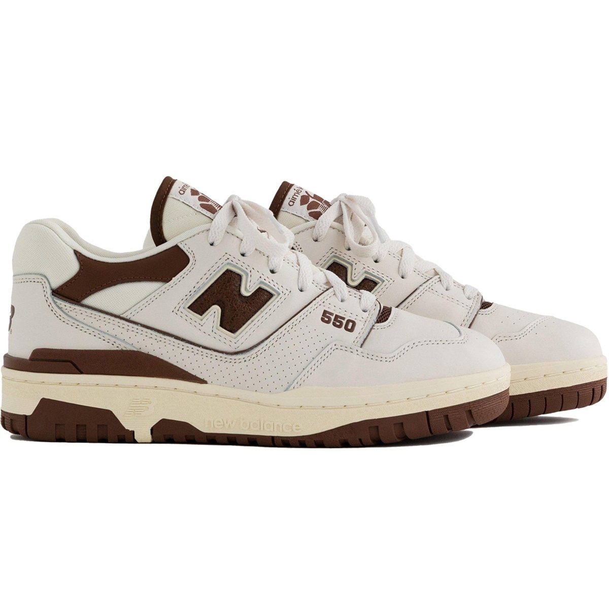 New Balance 550 Aime Leon Dore sneakers in brown and white leather with perforated detailing.