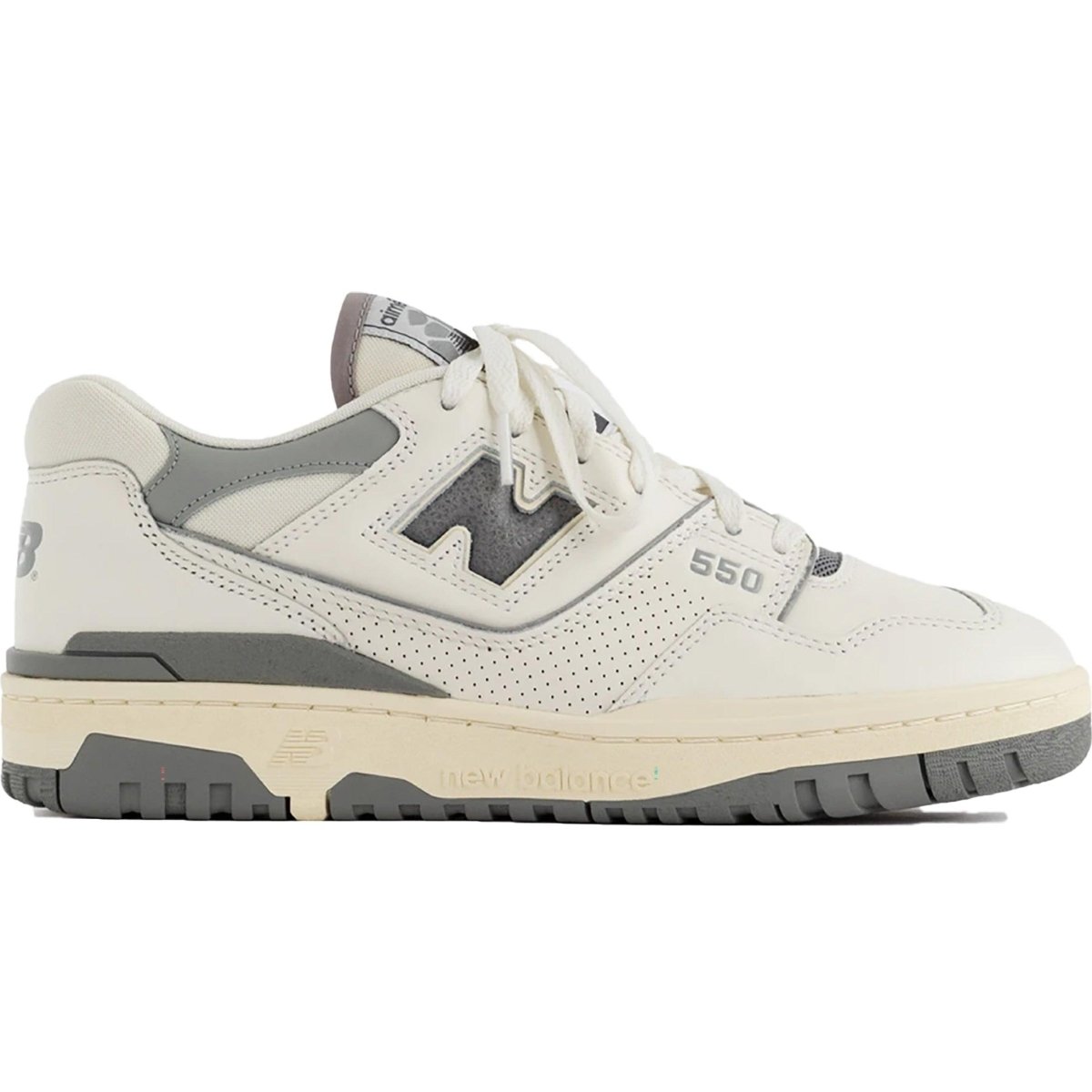 New Balance 550 Aime Leon Dore sneakers in white and grey with perforated detailing and neutral tones.