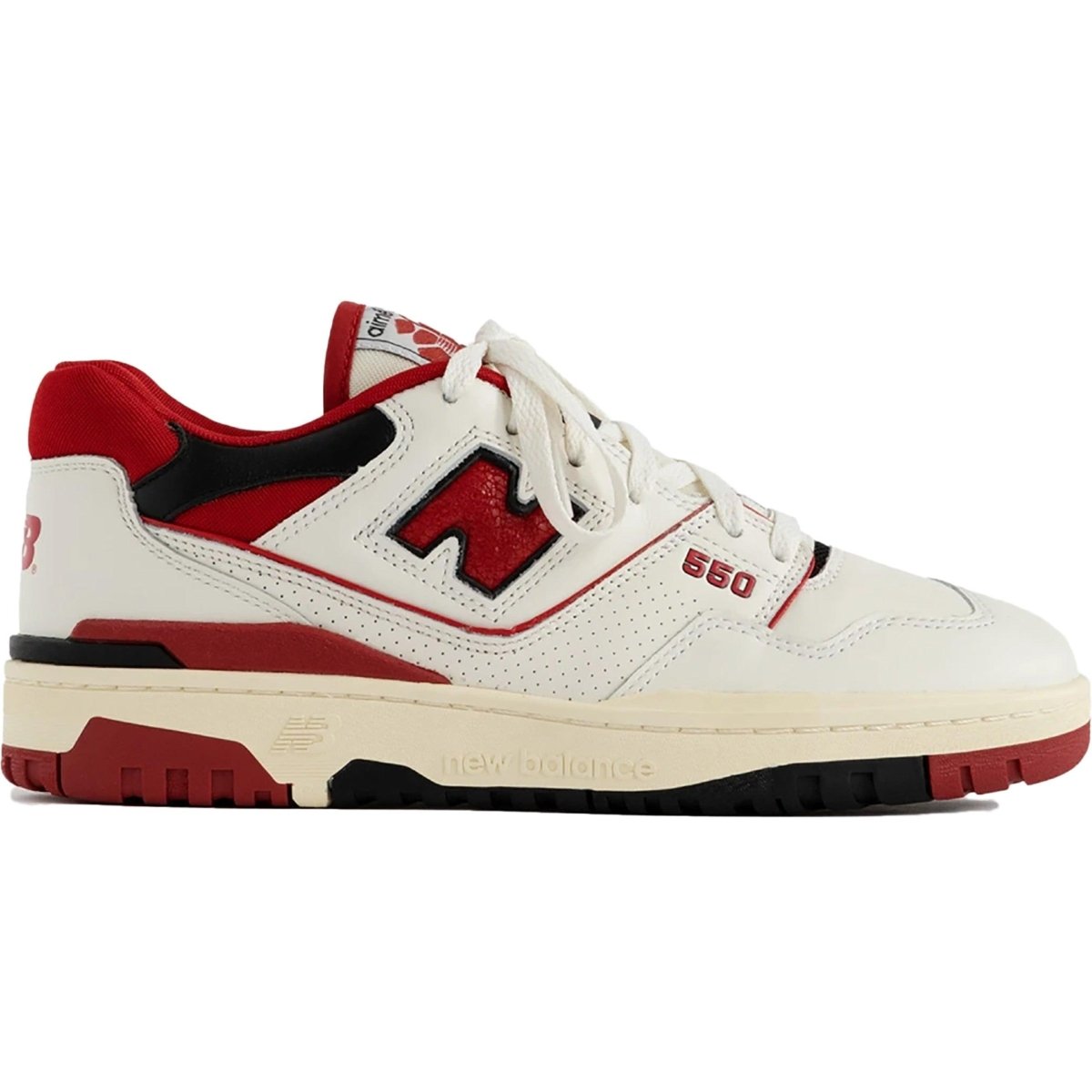 New Balance 550 Aime Leon Dore sneakers in white and red, featuring a classic basketball design and logo details.