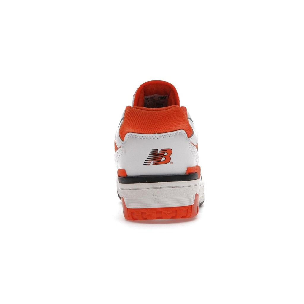 Back view of New Balance 550 Syracuse shoes featuring white leather and orange accents.