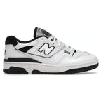 Side view of New Balance 550 sneakers in white and black, featuring smooth leather upper and iconic branding.