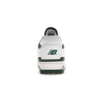 Retro New Balance 550 sneakers in white and green, featuring leather upper and distinctive logo on heel.