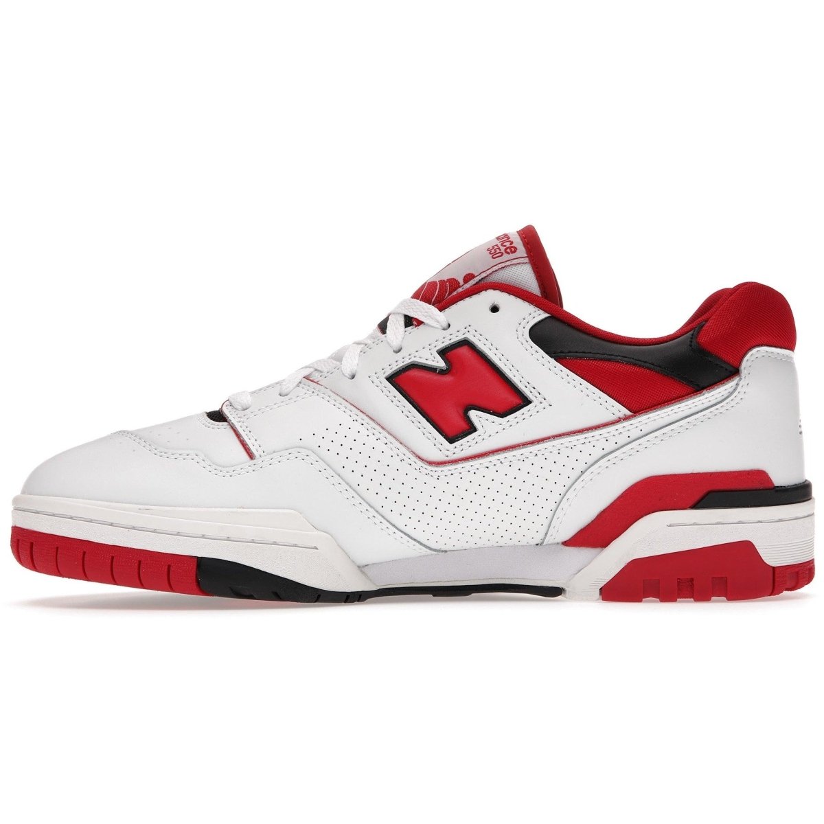 New Balance 550 sneaker in white and red, featuring a classic basketball shoe design with perforated detailing.