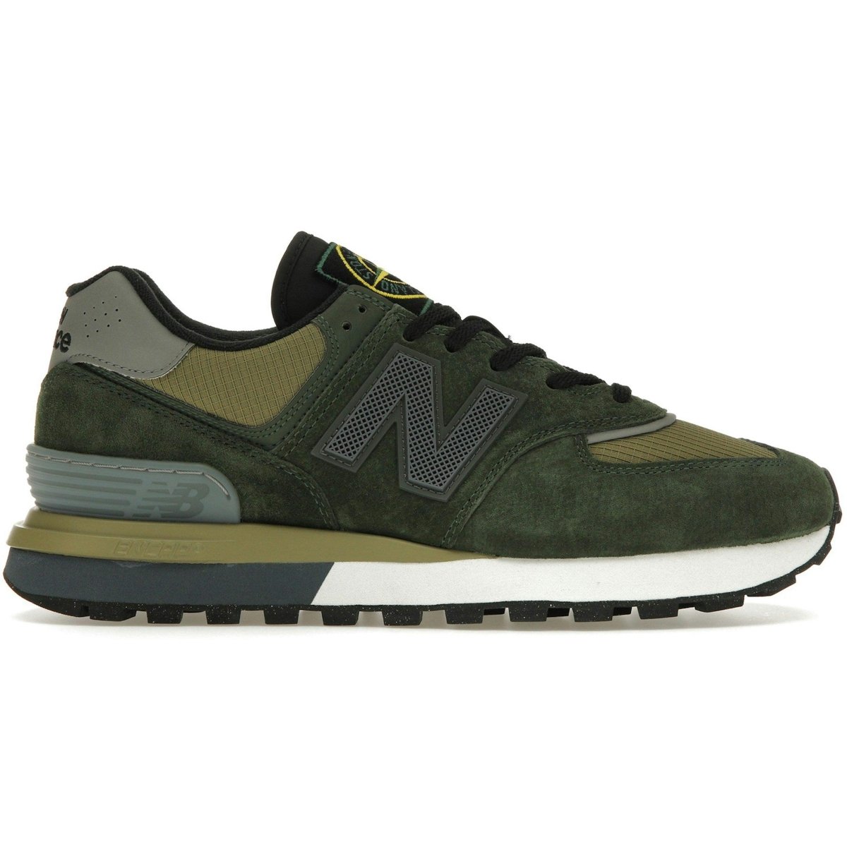 New Balance 574 Legacy sneaker in dark green with beige and grey accents, highlighting a stylish retro design.