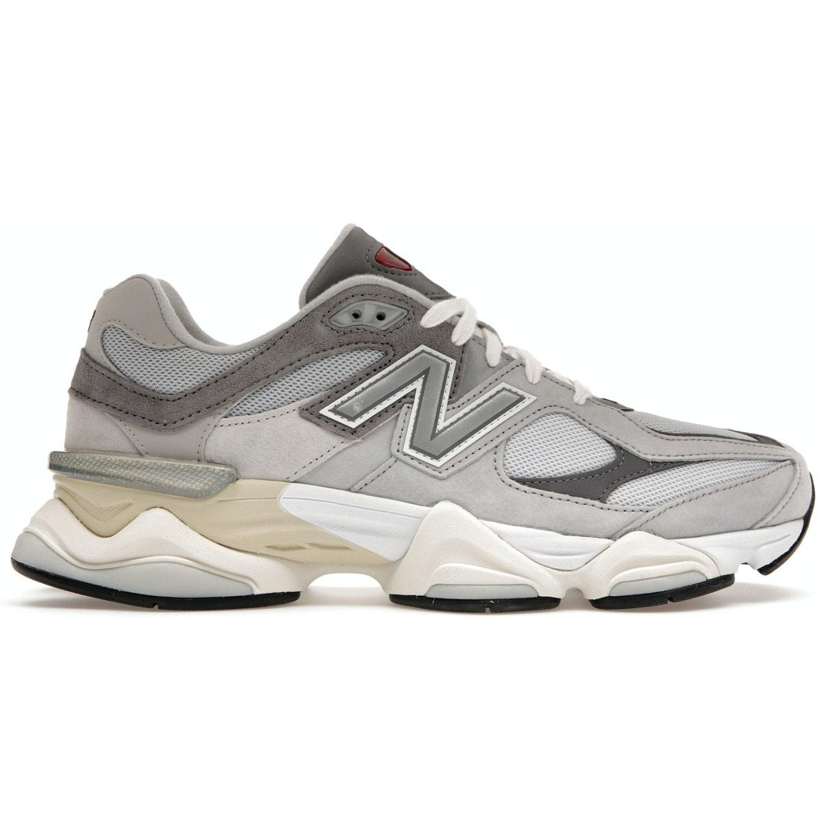 New Balance 9060 sneaker in Rain Cloud Grey with suede and mesh upper, featuring a stylish 'N' logo and dual-tone sole.
