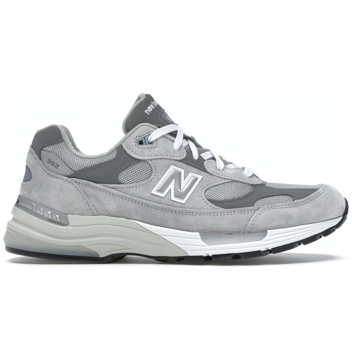 New Balance 992 in grey, featuring suede and mesh upper, white laces, and reflective details.