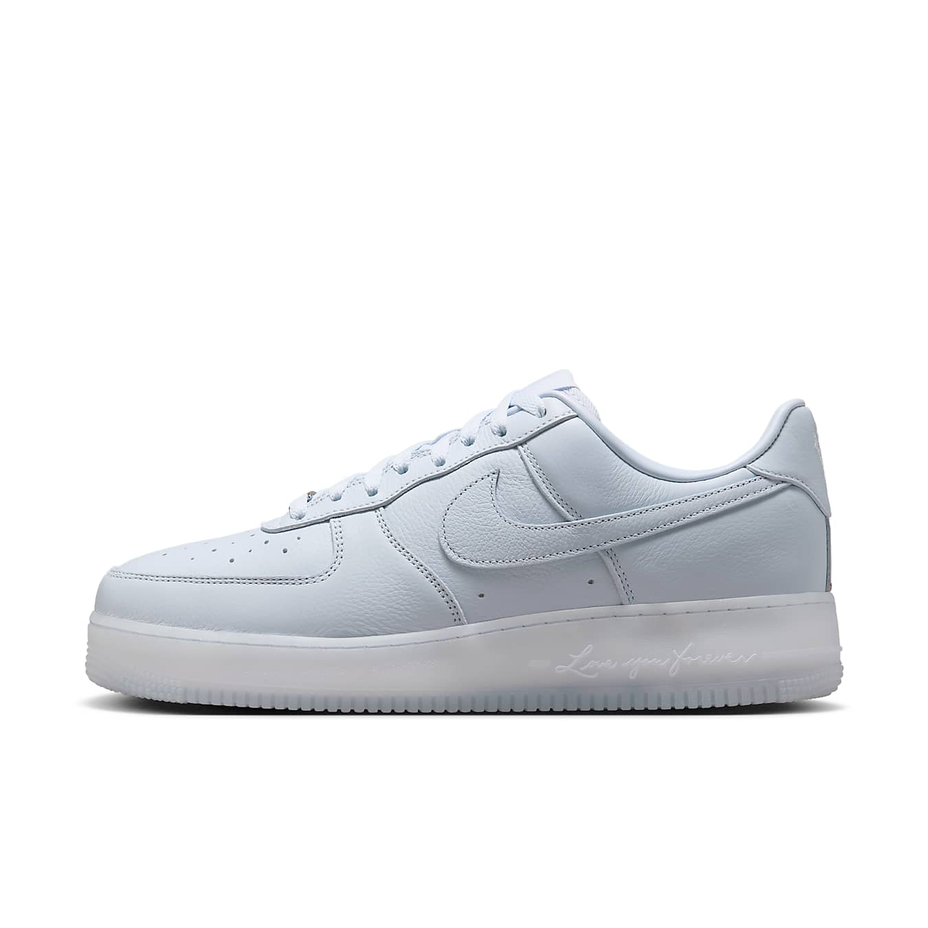 Nike Air Force 1 Low in pale blue leather with classic Swoosh logo, featuring minimalist design and sleek silhouette.
