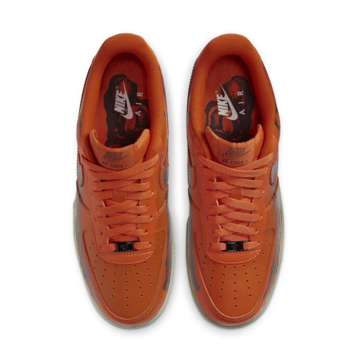 Top view of Nike Air Force 1 Low Orange Skeleton Halloween sneakers with vibrant orange leather upper.