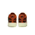Back view of Nike Air Force 1 Low Orange Skeleton with unique design and Nike branding.