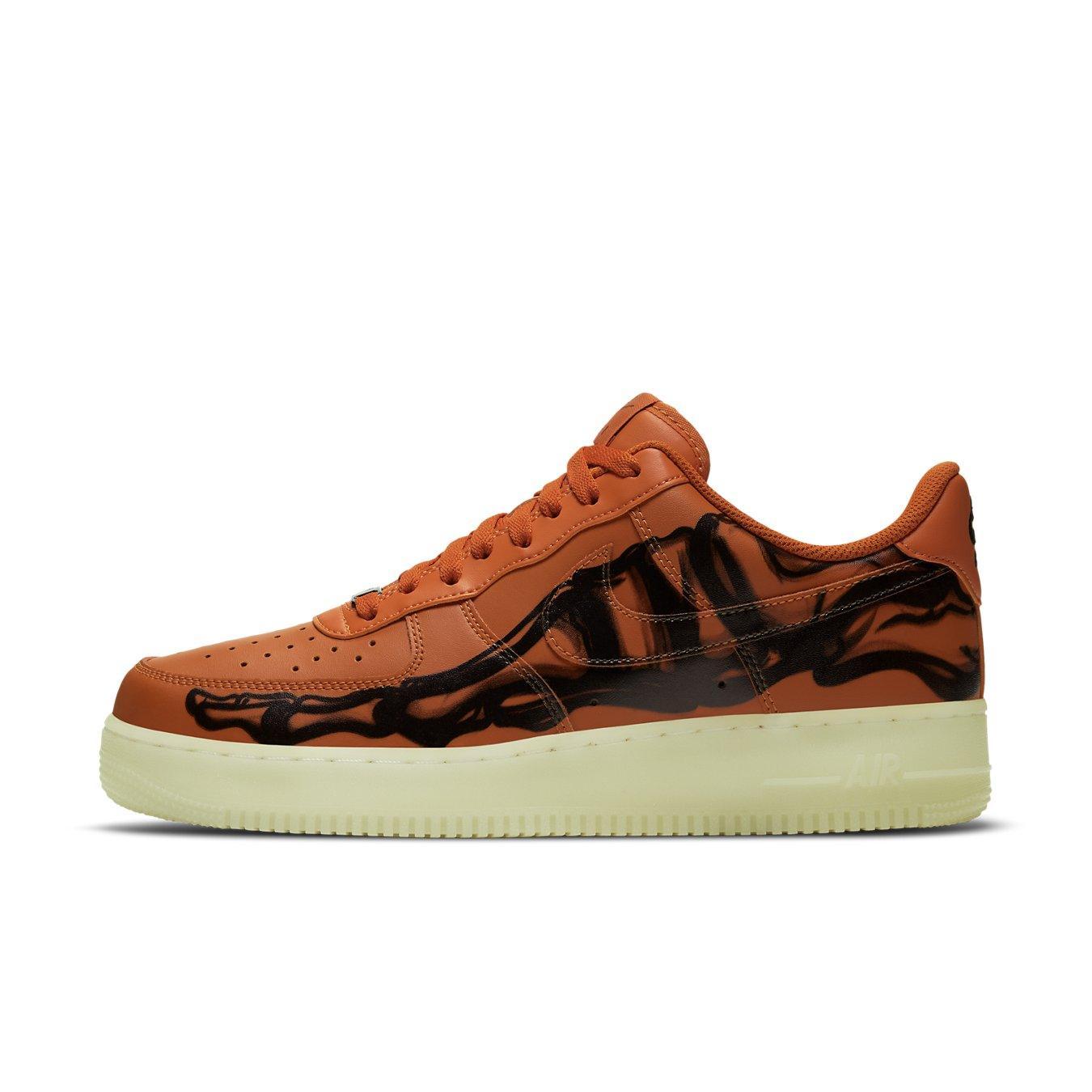 Nike Air Force 1 Low Orange Skeleton Halloween sneaker with black skeleton design and orange leather upper.