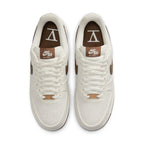 Nike Air Force 1 Low SNKRS Day 5th Anniversary in white and brown, featuring a classic design and stylish accents.