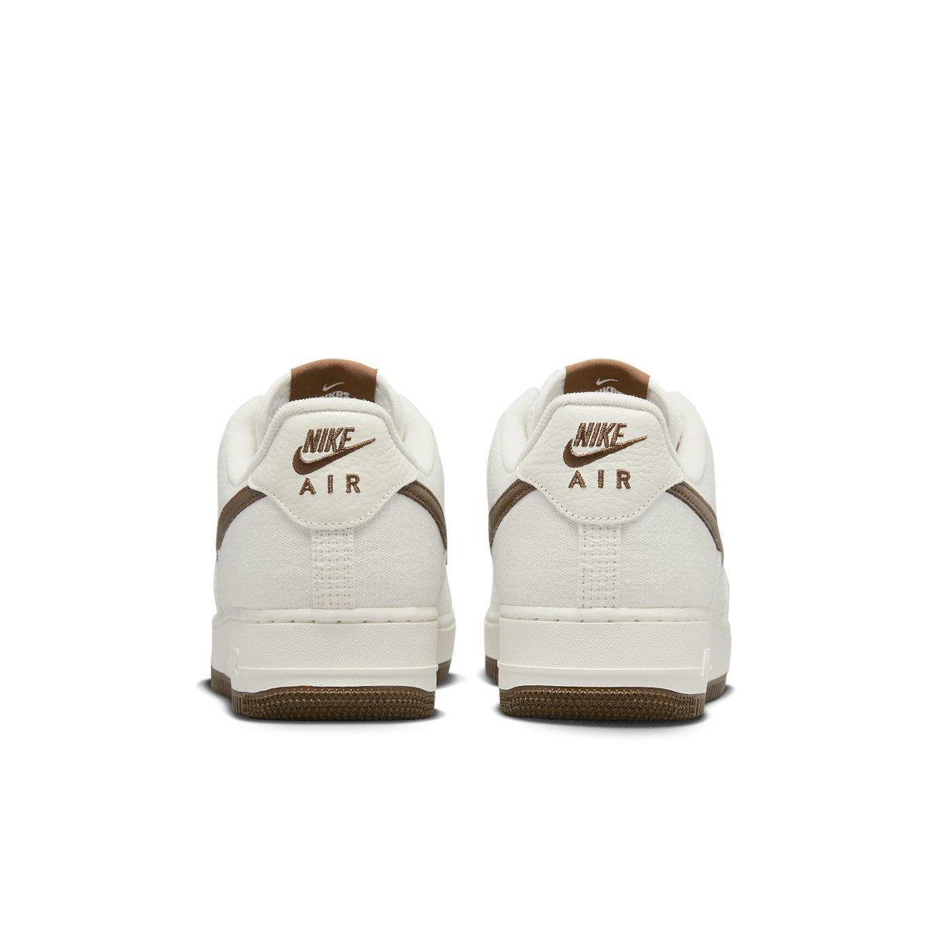 Back view of Nike Air Force 1 Low SNKRS Day 5th Anniversary sneakers featuring a white and brown color scheme.