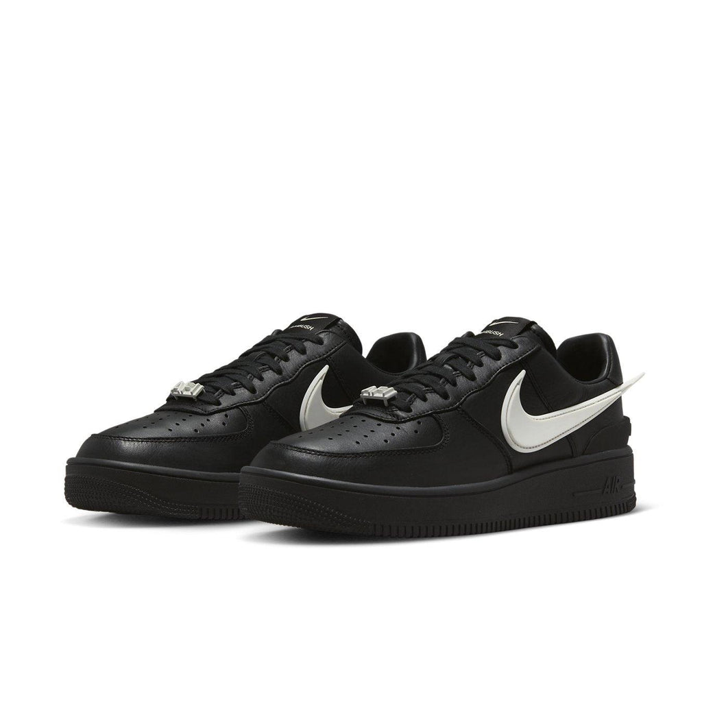 Nike Air Force 1 Low SP AMBUSH in black leather with contrasting white Swoosh and co-branding details.
