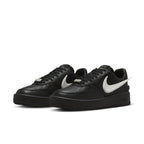 Nike Air Force 1 Low SP AMBUSH in black leather with contrasting white Swoosh and co-branding details.