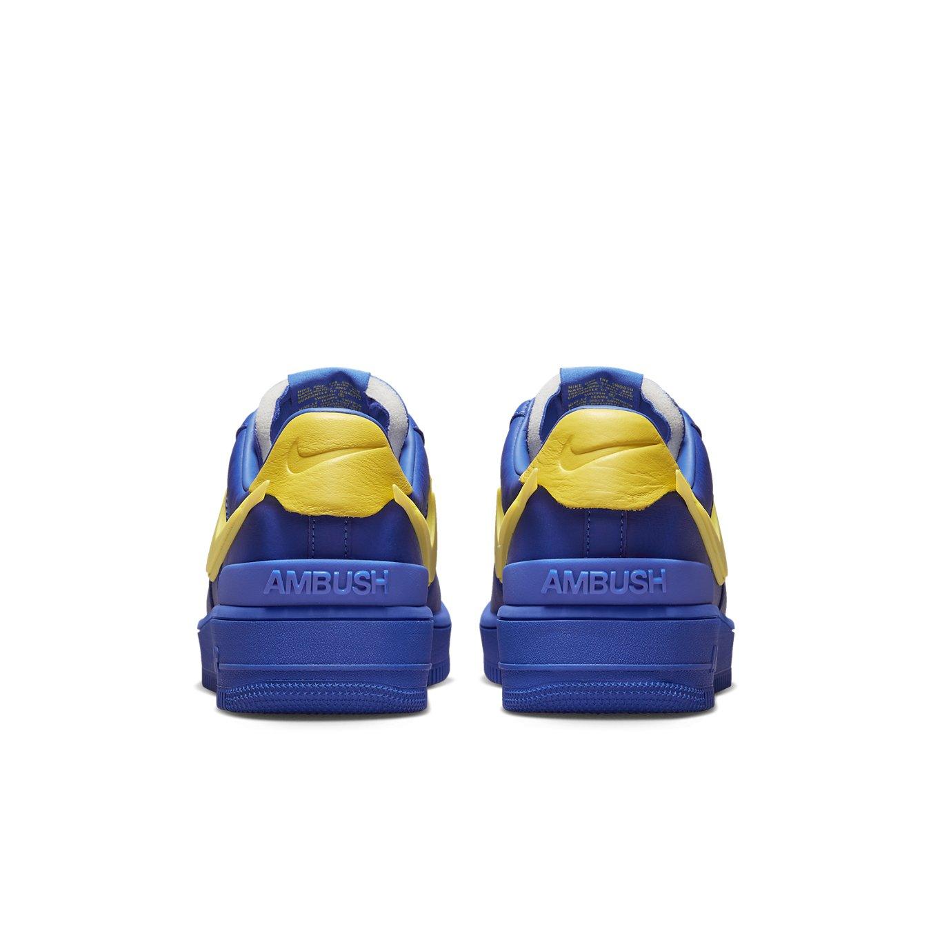 Back view of Nike Air Force 1 Low SP AMBUSH in Game Royal and yellow colorway, showcasing unique design details.