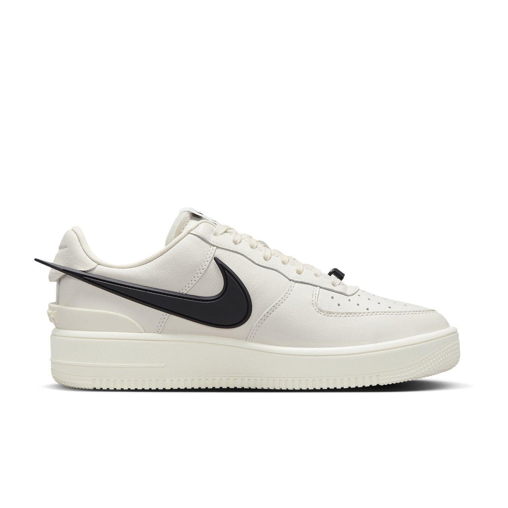 Nike Air Force 1 Low SP AMBUSH Phantom sneakers in cream with black swoosh detail.