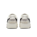 Back view of Nike Air Force 1 Low SP AMBUSH Phantom sneakers with black accents and embossed AMBUSH logo.