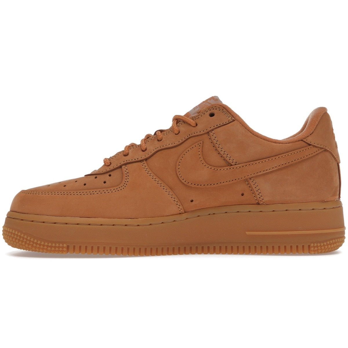 Nike Air Force 1 Low SP Supreme Wheat sneakers in smooth tan nubuck, featuring a classic design and Supreme branding.