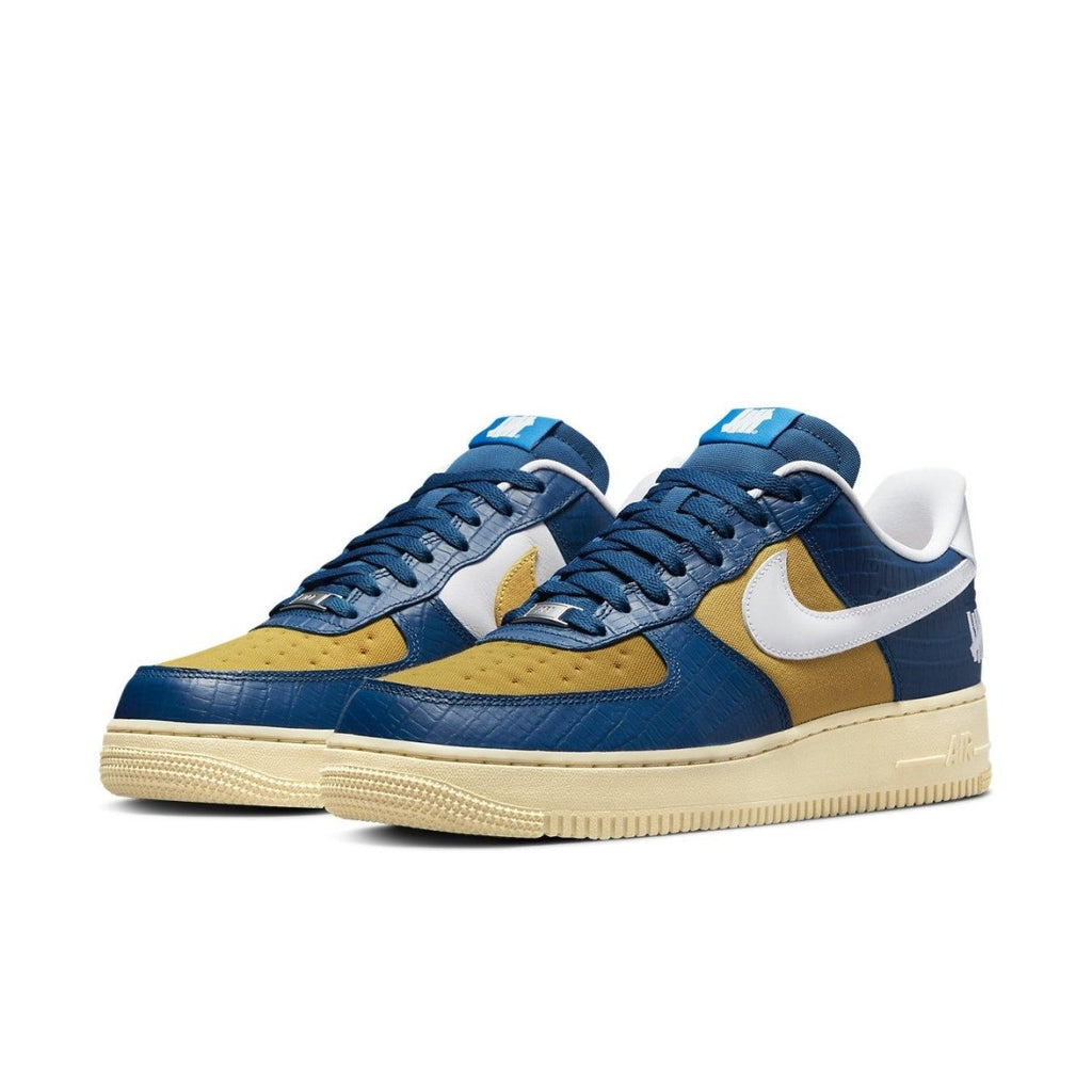 Nike Air Force 1 Low SP Undefeated 5 On It in blue and yellow croc design, featuring premium materials and unique patterns.