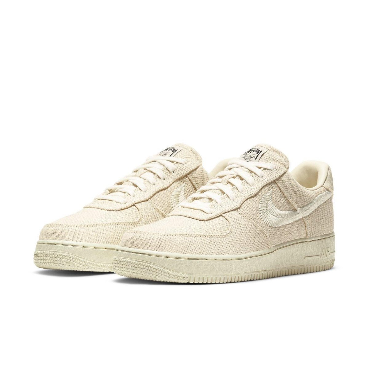 Nike Air Force 1 Low Stussy Fossil sneakers in beige hemp, showcasing co-branding design and classic silhouette.