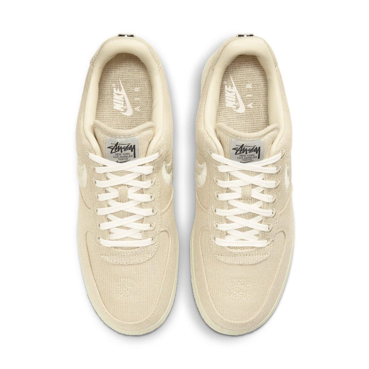Nike Air Force 1 Low Stussy Fossil sneakers in beige hemp, featuring a sleek design and classic silhouette.