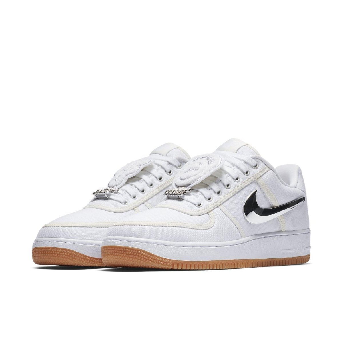 Nike Air Force 1 Low Travis Scott shoes in white leather with black swoosh and gum sole.