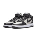 Nike Air Force 1 Mid Stussy Light Bone Black with premium leather panels in black and white.