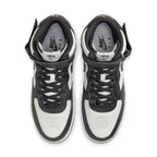 Nike Air Force 1 Mid Stussy Light Bone Black sneakers with black leather details and white accents, top view.
