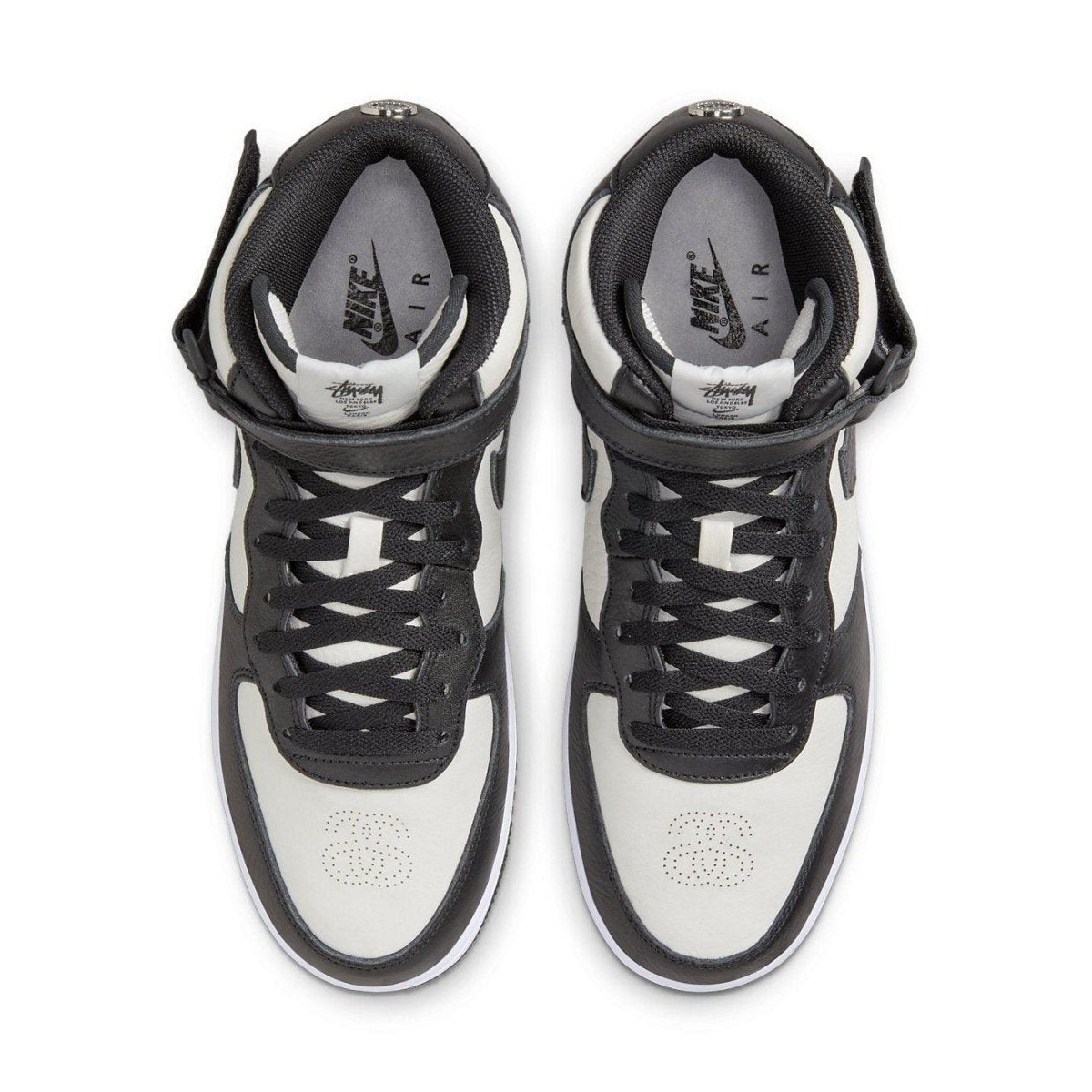 Nike Air Force 1 Mid Stussy Light Bone Black sneakers with black leather details and white accents, top view.