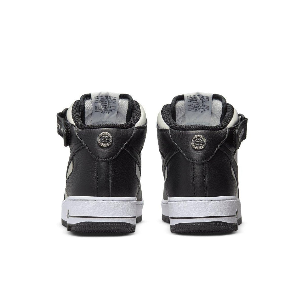 Rear view of Nike Air Force 1 Mid Stussy in Light Bone Black featuring premium leather design.