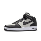 Nike Air Force 1 Mid Stussy in light bone and black with premium leather and stylish details.