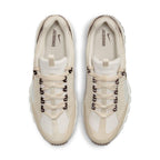 Nike Air Humara LX Jacquemus sneakers in light bone and gold with cream leather and suede overlays.