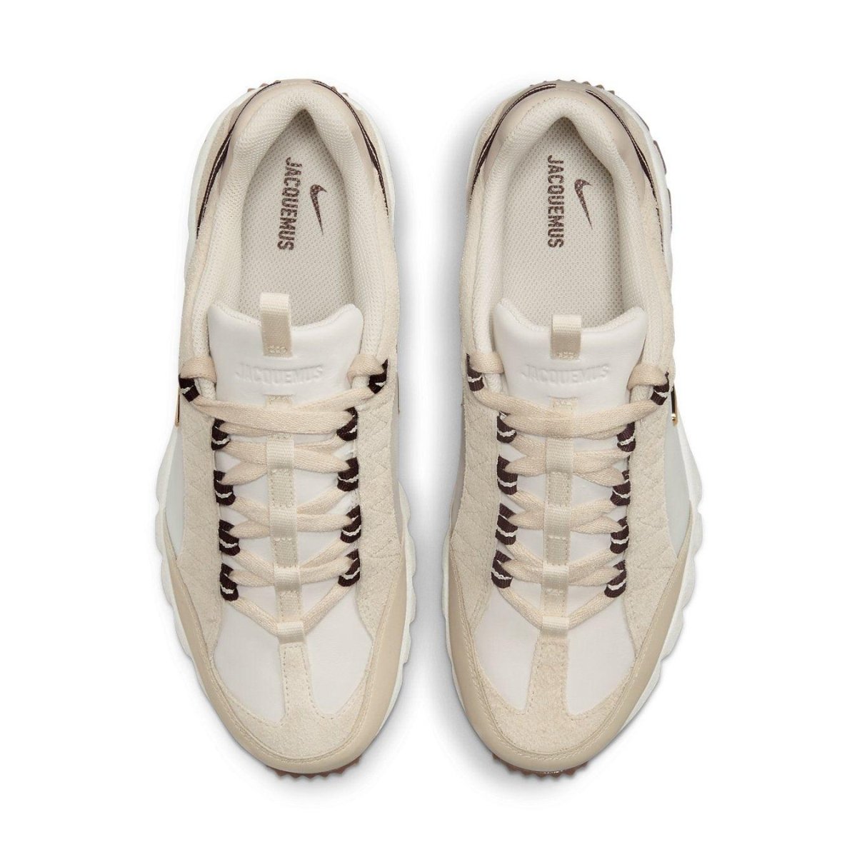 Nike Air Humara LX Jacquemus sneakers in light bone and gold with cream leather and suede overlays.