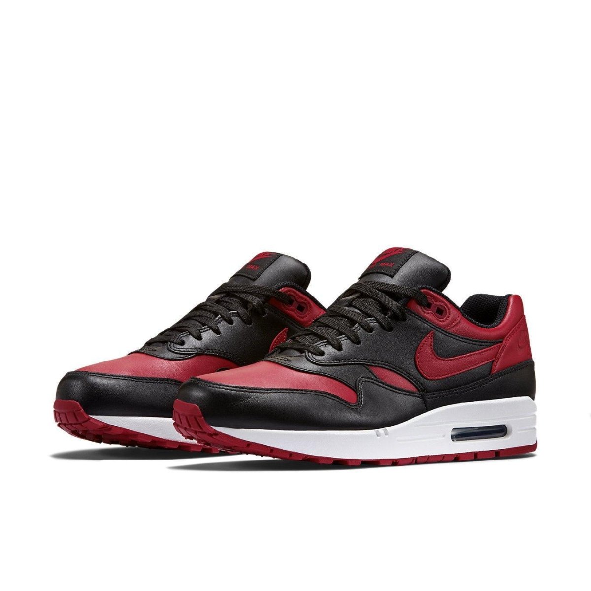 Nike Air Max 1 Bred sneaker featuring premium leather in Varsity Red and black with visible Air unit.