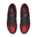Top view of Nike Air Max 1 Bred sneaker in black and Varsity Red with brand logo.