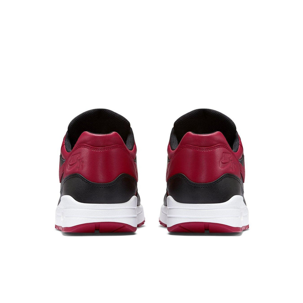 Nike Air Max 1 Bred rear view featuring premium leather in Varsity Red and black, showcasing stylish design and comfort.