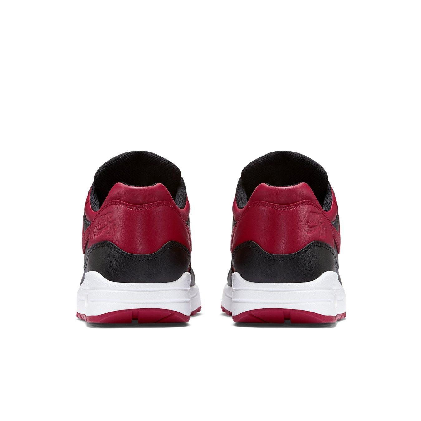 Nike Air Max 1 Bred rear view featuring premium leather in Varsity Red and black, showcasing stylish design and comfort.