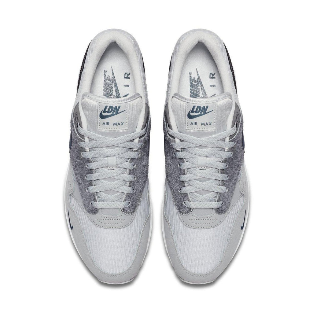 Nike Air Max 1 London sneakers showcasing a grey and white colorway with suede materials for an urban style.