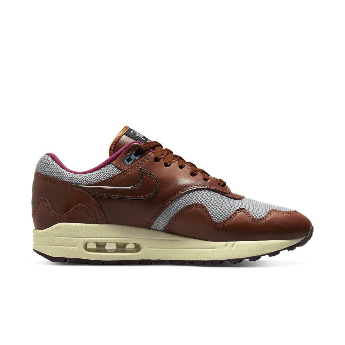 Nike Air Max 1 Patta The Next Wave in Dark Russett colorway, featuring a sleek design with metallic silver accents.