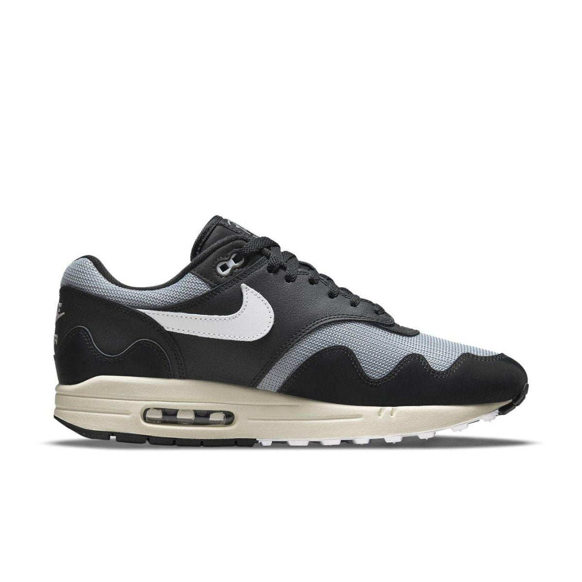 Nike Air Max 1 Patta Waves in Black and Grey with Coconut Milk sole, featuring a sleek design and mini-swoosh.