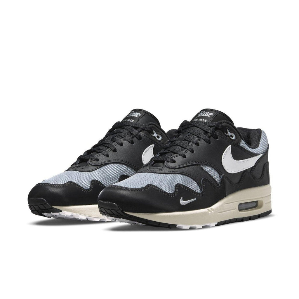 Nike Air Max 1 Patta Waves Black, featuring a unique wavy design and synthetic leather accents.