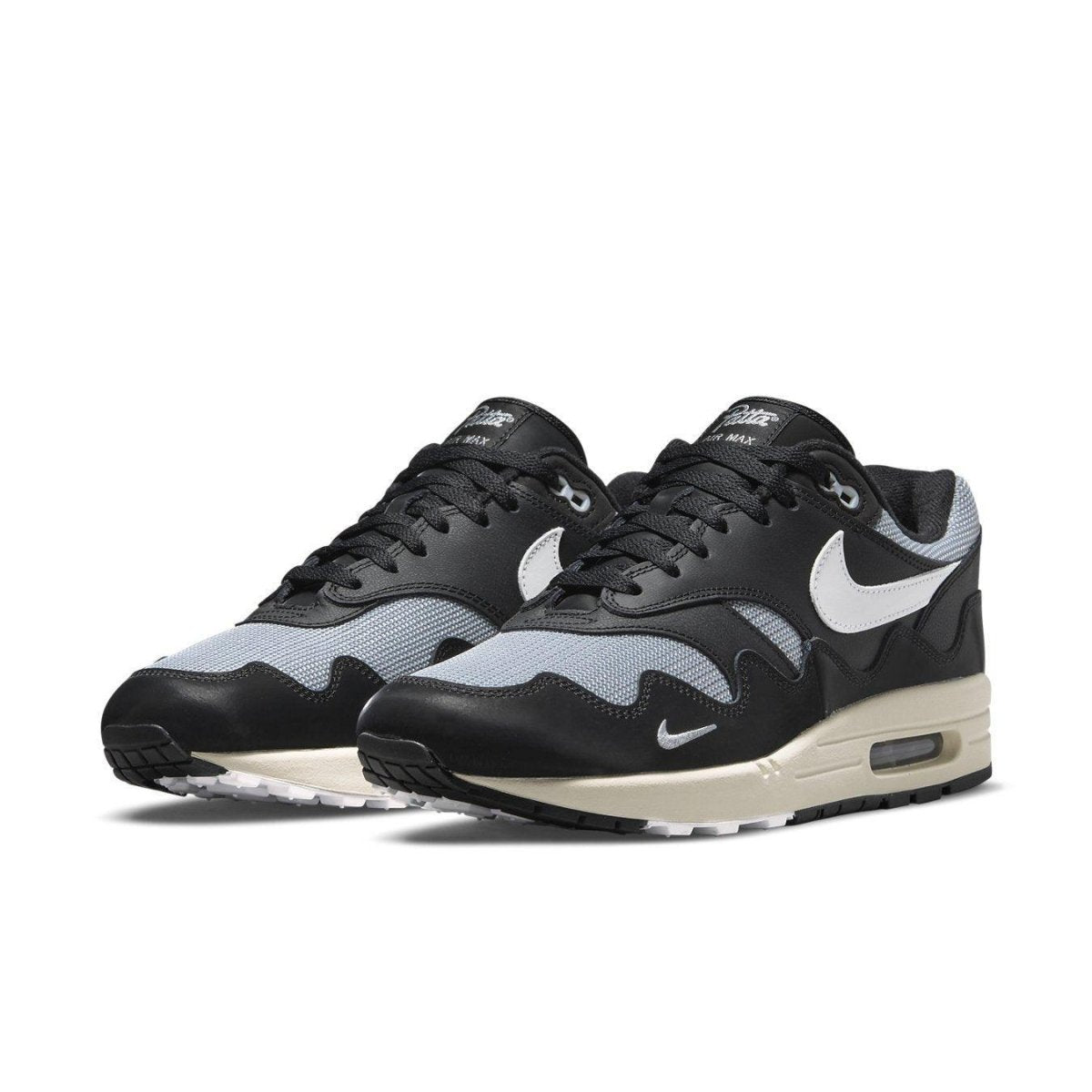Nike Air Max 1 Patta Waves Black, featuring a unique wavy design and synthetic leather accents.