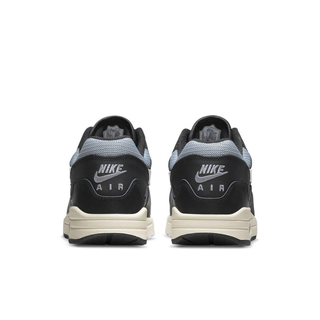 Nike Air Max 1 Patta Waves Black shoes from the back, featuring unique wave design and Air branding.