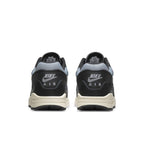 Nike Air Max 1 Patta Waves Black shoes from the back, featuring unique wave design and Air branding.