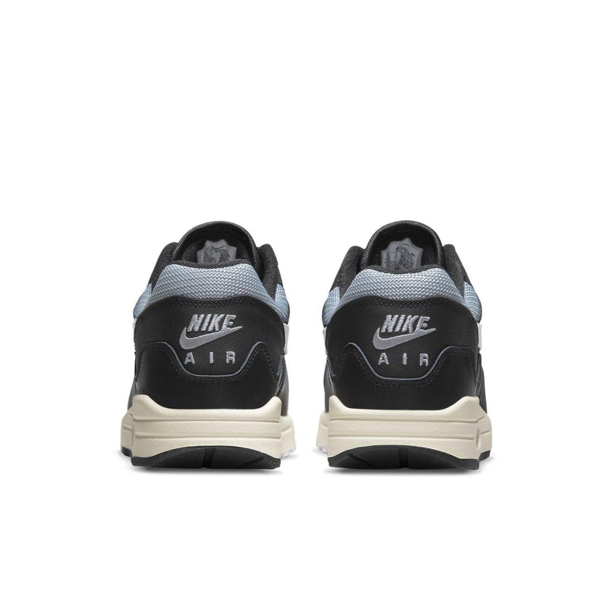 Nike Air Max 1 Patta Waves Black shoes from the back, featuring unique wave design and Air branding.