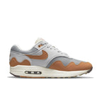 Nike Air Max 1 Patta Waves Monarch sneaker with gray and brown waves design, featuring the iconic Swoosh logo.