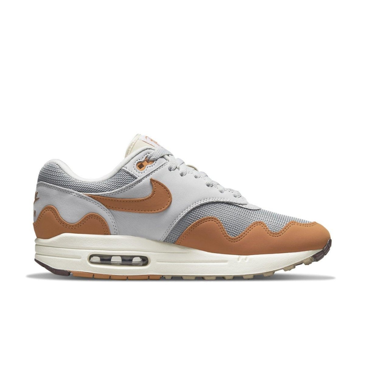 Nike Air Max 1 Patta Waves Monarch sneaker with gray and brown waves design, featuring the iconic Swoosh logo.