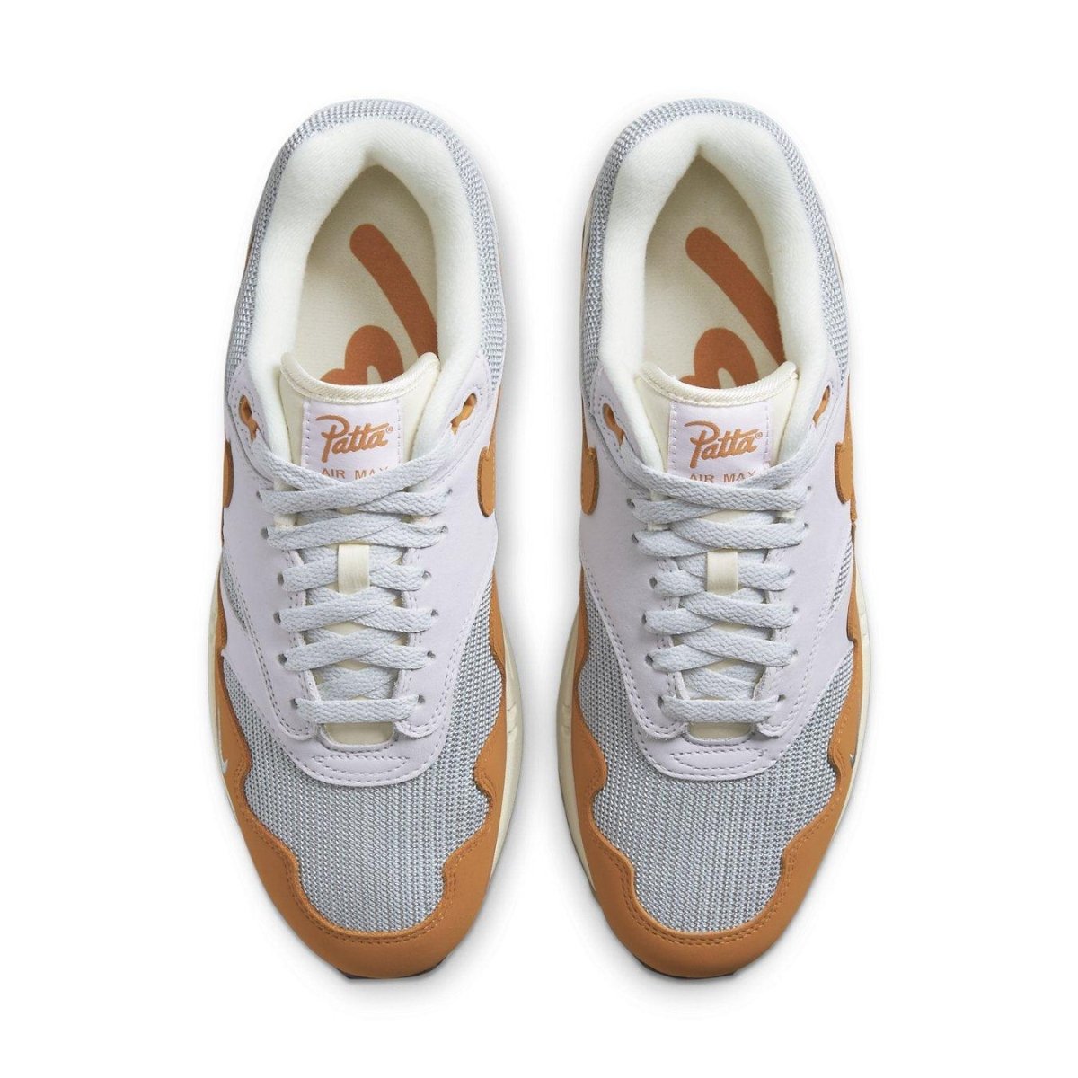 Nike Air Max 1 Patta Waves Monarch sneakers in white and orange, featuring Patta logo and unique wave design.