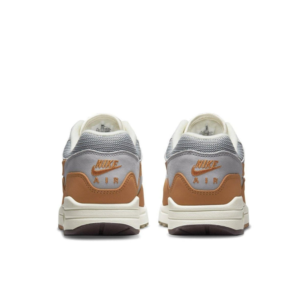 Nike Air Max 1 Patta Waves Monarch sneakers featuring grey and brown colorway from the rear view.