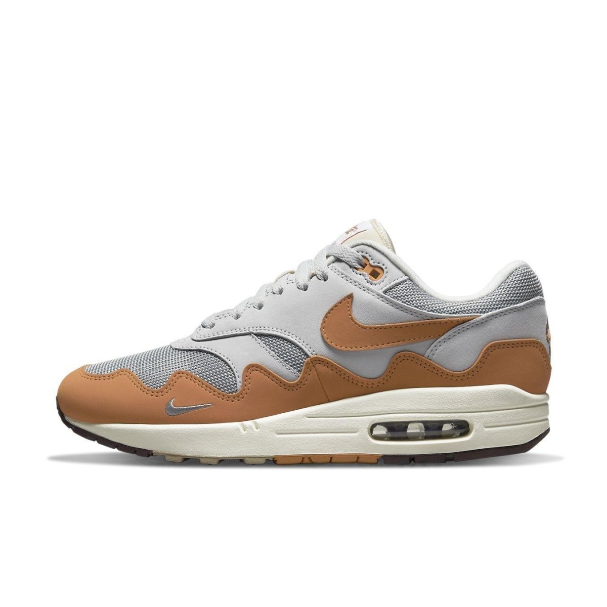 Nike Air Max 1 Patta Waves Monarch in gray and brown, featuring a unique wavy design and iconic Nike Swoosh.